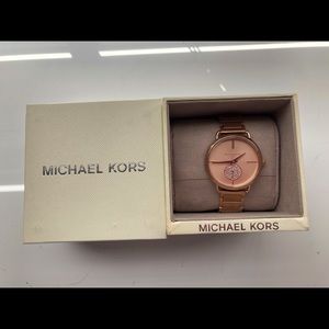 Authentic rose gold Michael Kors watch. Never worn except in these photos.